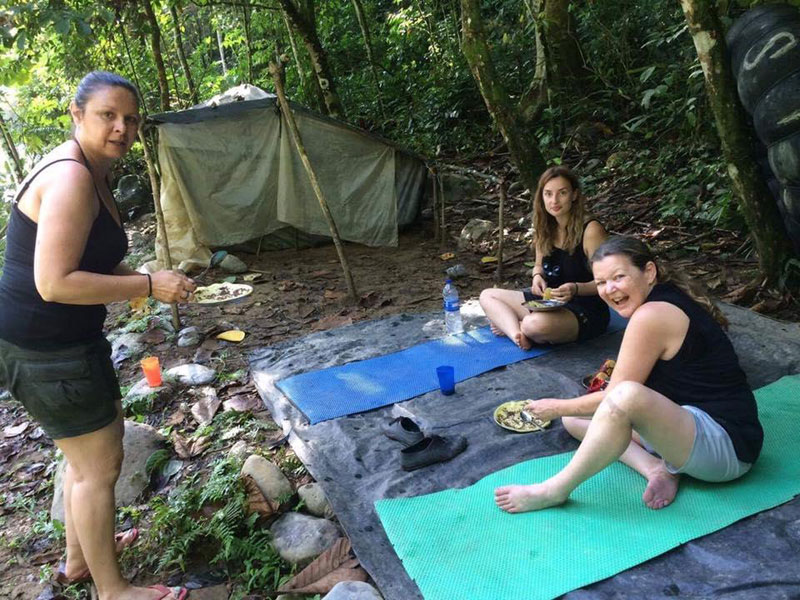 Relaxing by the river at a temporary jungle camp.