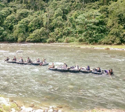 Rafting back to the village after a trek.