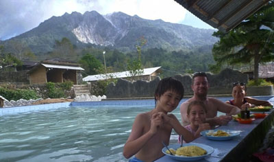 After an early morning hike up Mount Sibayak, relax and soak your tired muscles away at the natural hot springs in Berastagi.
