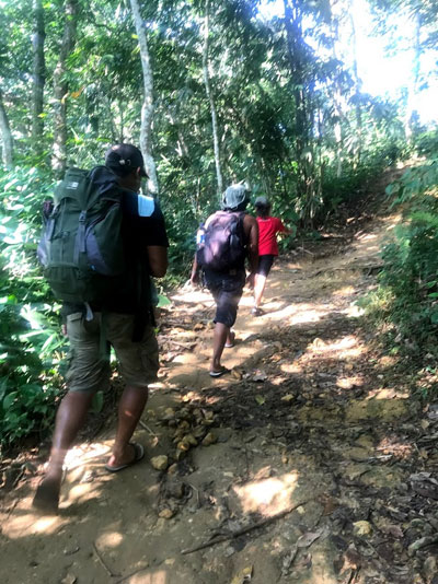 Entering the National Park by the community forest.